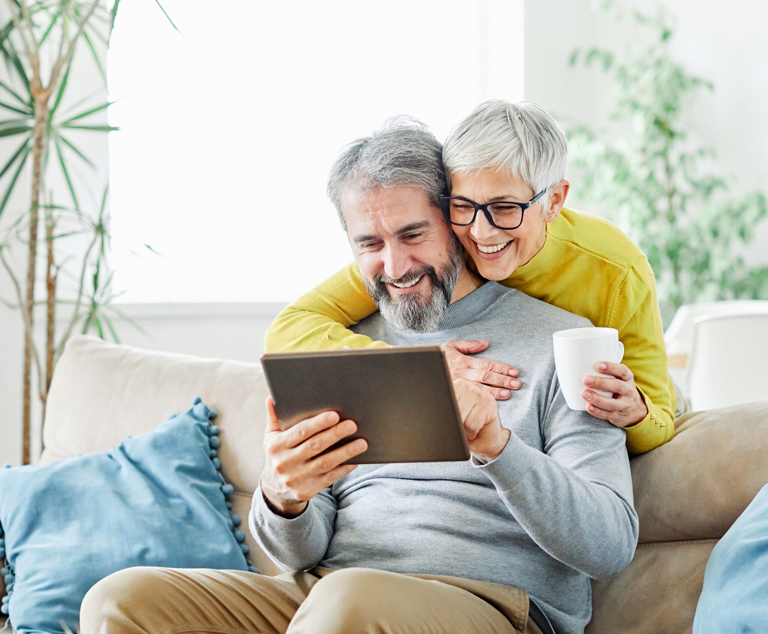Senior couple reviewing information together at home
