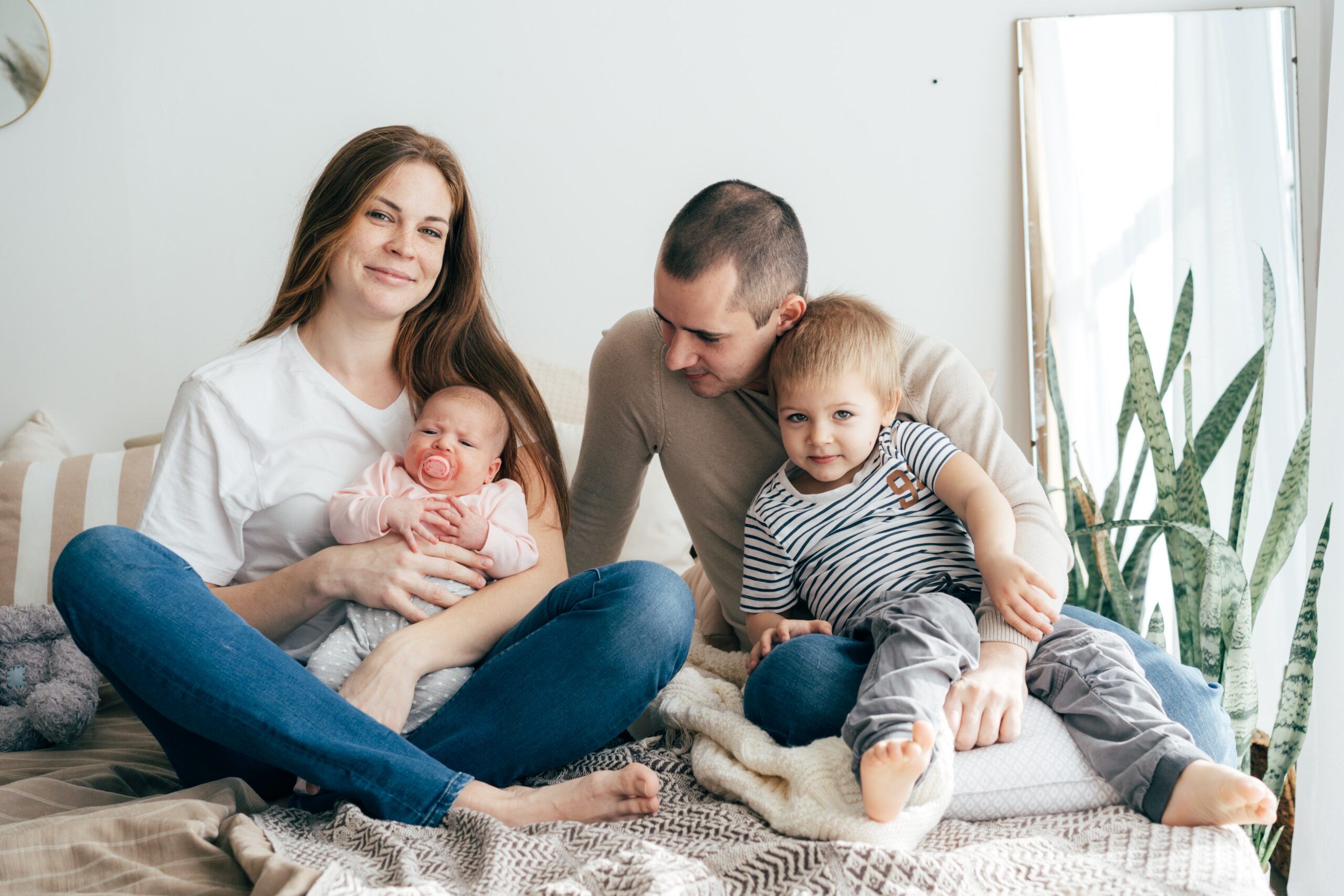 Parents with young children spending time together at home