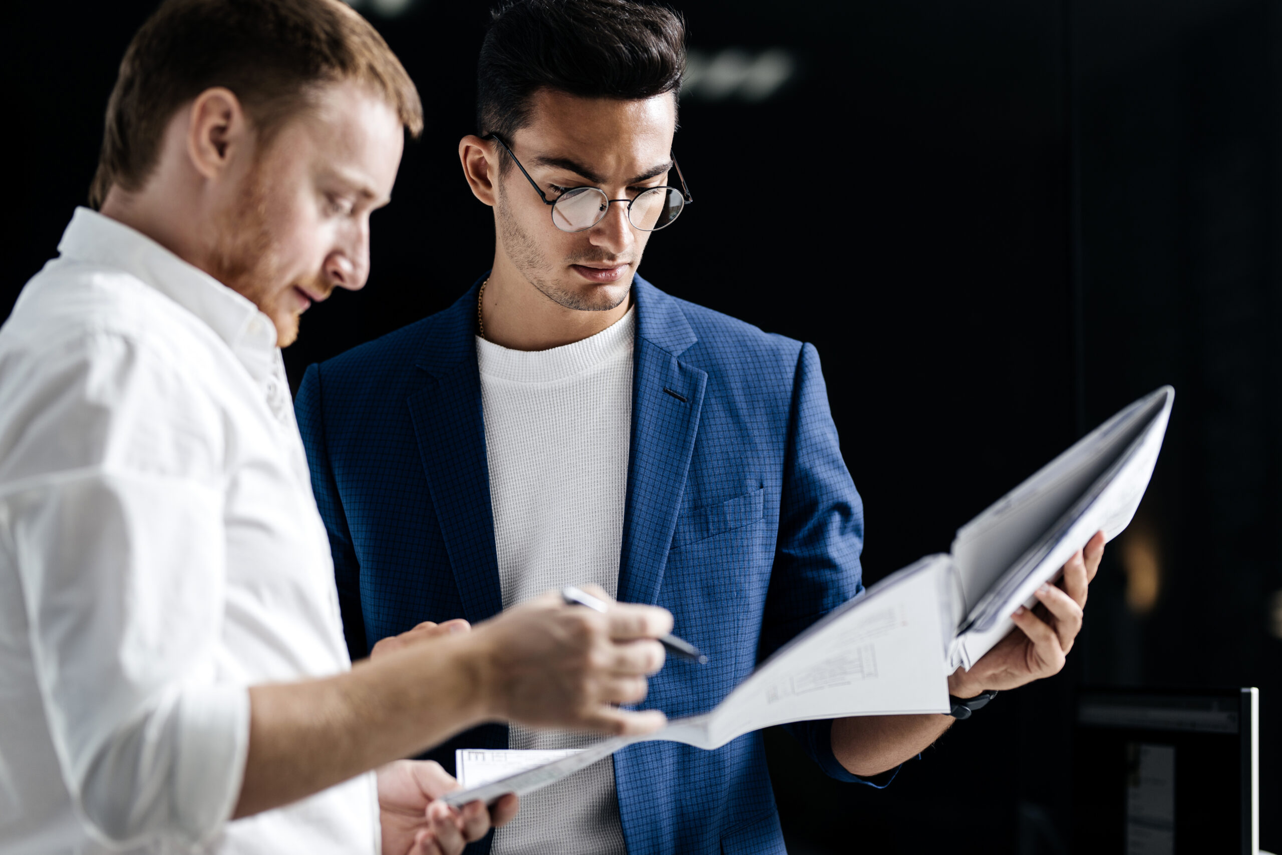 Business professionals reviewing documents together in an office